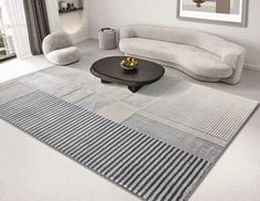 a modern living room with white furniture and striped rug