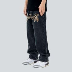 Elevate your urban style with the 2023 Autumn Collection of men's jeans with front inscriptions! These baggy. mid-waist jeans feature a stylish zipper and button closure. plus eye-catching stitched designs that will set you apart from the crowd. Let your individual style shine with these street-inspired jeans!Distinctive Features: Street Style: Stand out from the crowd with these street-inspired jeans. featuring eye-catching embroidered designs. Baggy Fit: Get a comfortable. casual fit with thes Straight Leg Pants With Letter Print For Streetwear, Hip Hop Wide Leg Jeans With Graphic Print, Urban Jeans With Letter Print For Streetwear, Straight Leg Bottoms With Graphic Print For Streetwear, Straight Leg Graphic Print Bottoms For Streetwear, Graphic Print Straight Leg Bottoms For Streetwear, Trendy Letter Print Pants For Streetwear, Hip Hop Jeans With Graphic Print And Straight Leg, Urban Pants With Graphic Print For Streetwear