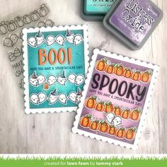 three halloween stamps are sitting next to each other on a table with the words boo and spooky