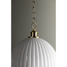 a white and gold light hanging from a ceiling fixture with a chain attached to it