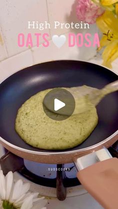 a person is cooking food in a pan with a spatula on the stove top