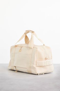 The Sport Duffle in Beige | Béis Sporty Double Handle Gym Bag For On-the-go, Sporty Large Capacity Luggage For On-the-go, Large Capacity Sporty Luggage, Functional Bags With Double Handle For Overnight Trips, Functional Double Handle Bags For Overnight Trips, Functional Backpack-style Duffle Bag With Zipper, Functional Backpack Duffle Bag With Zipper, Functional Tote Duffle Bag For Overnight Trips, Functional Duffle Tote Bag For Overnight Trips