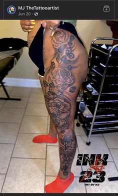 a woman with tattoos on her legs and red shoes