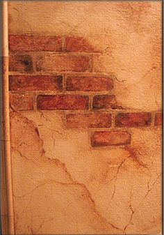 an old brick wall with peeling paint on it