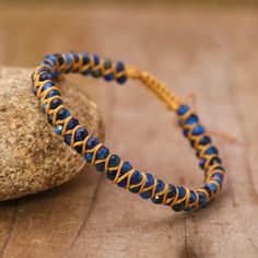 Indulge in the timeless beauty of the Blue Tiger Eye Boho Faceted Crystal Bead Woven Bracelet. Made with expert craftsmanship and high-quality natural stones, this stunning bracelet effortlessly exudes style and sophistication. The intricate weaving of the blue tiger eye beads create a unique and eye-catching texture. The natural stone of the tiger eye exudes an elegant sheen that perfectly contrasts the subtle sparkle of the crystal beads. This exquisite piece of jewelry is not just stylish, bu Blue Spiritual Braided Bracelets Hand-strung, Adjustable Lapis Lazuli Beaded Bracelets Bohemian Style, Adjustable Lapis Lazuli Gemstone Beaded Bracelets, Adjustable Lapis Lazuli Crystal Bracelet Spiritual Style, Adjustable Spiritual Lapis Lazuli Crystal Bracelet, Adjustable Lapis Lazuli Beaded Bracelet With Faceted Beads, Bohemian Lapis Lazuli Beaded Bracelets With Natural Stones, Bohemian Beaded Bracelets With Lapis Lazuli Stones, Bohemian Beaded Bracelets With Lapis Lazuli