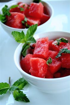 two white bowls filled with watermelon and mint