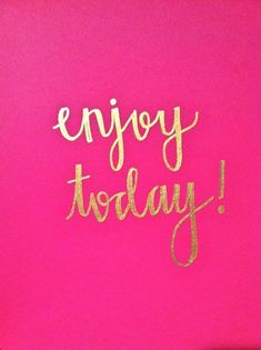 the word enjoy today written in gold paint on a pink background with an inscription that reads,