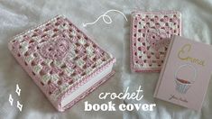 the crochet book cover is pink and white