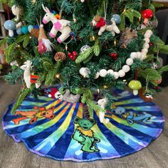 7 - 10 Day Production Time during the holidays. 'Tis the season to be Grateful! Jerry Claus is sure to leave lots of great presents under your Christmas Tree with our Grateful Dead Rainbow Dancing Bears Christmas Tree Skirt! Decorate your home in pure Deadhead holiday style! Officially licensed by Grateful Dead Hemmed edges 44" Round Care Instructions: Spot Clean / Dry Clean Only Made in USA Rainbow Dance, Dancing Bears, Note Box, Toddler Hoodie, Holiday Style, Be Grateful, Tree Skirt, Grateful Dead, Holiday Fashion