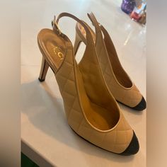 Authentic Chanel Sling Back Heels. Lightly Worn On Bottom, Top Of Shoe Looks New. Size 39. Black Cap Toe Has Chanel Logo On It. Adjustable Ankle Strap. Shoes Chanel, Sling Back Heels, Chanel Logo, Slingback Heels, Black Cap, Slingback Heel, Sling Back, Chanel Shoes, Black And Tan