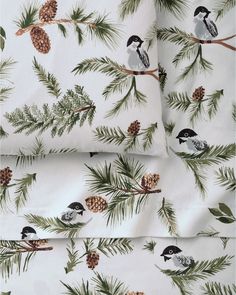 pine cones and birds on white cotton fabric