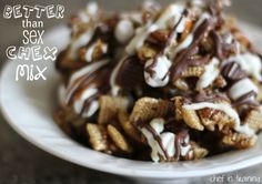 a white plate topped with chocolate covered pretzels and marshmallow toppings