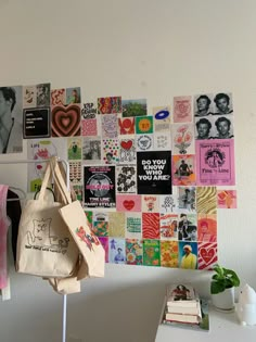 there is a wall with many pictures on it and a bag hanging from the side