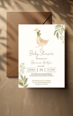 a baby shower is shown with a duck and leaves on the front, and a brown envelope