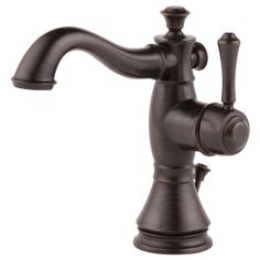 an antique style faucet with two handles and nozzles on the side