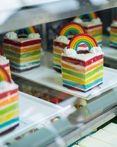 there are many rainbow cakes on the shelves