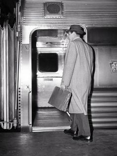 Size: 12x9in 1950s BACK VIEW OF A MAN BUSINESSMAN CARRYING LEATHER BRIEFCASE WEARING TOP COAT AND HAT COMMUTE...We have more Panoramic Images Posters. Choose from our catalog of over 500,000 posters! 1950s Man, 1950s Men, 1950s Mens, Mystery Dinner, What Is An Artist, Vintage Business, Vintage Suits, Briefcase For Men, Back View