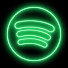 a green neon sign in the middle of a black background with an oval shape on it