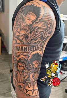 the back of a man's arm with an image of two cartoon characters on it