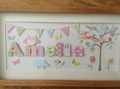 a wooden frame with some magnets on it and an animal themed name in the middle