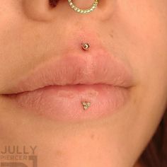 a woman's nose with a piercing on it