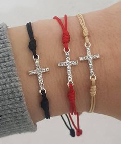 "Bracelet on cord with CZ cross. Cord saints bracelets handmade in Medjugorje. Eache bracelet is made to order, just for you. Bracelet comes in adult size , 10'' (25.5 cm) when fully opened. If you want size for kids , just send us a message. Kids size: 7.5 inch (19 cm) when fully opened. Cord tickeness:1.2 mm Cross: Cubic zirconia Cross size: 2 cm x1 cm At the end is small saint medal. Choose color of cord and saint medal for your bracelet, and it will be made for you. Ideal gifts for ocassions Adjustable Cross Pendant Jewelry, Spiritual Cross Jewelry With Adjustable Cord, Cross Bracelets With Sliding Knot For Gifts, Adjustable Cross Jewelry With Cord, Adjustable Cross Jewelry With Adjustable Cord, Spiritual Cross Bracelets With Sliding Knot, Adjustable Cross-shaped Jewelry With Cord, Adjustable Length Cross Jewelry For Gift, Our Lady Of Medjugorje