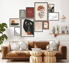 a living room filled with furniture and pictures on the wall above it's coffee table