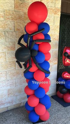 a balloon sculpture made out of red, white and blue balloons