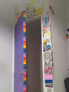 an open door is decorated with colorful strips