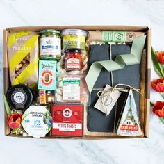 a box filled with food and condiments on top of a table