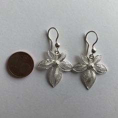 "Silver Earrings Orchids - Filigree Earrings - Filigree Jewelry - Women Earrings - Flower Earrings - Silver Dangle Earrings - Handmade Filigree - delicate jewellery technique made from silver or golden threads \"embroidering\" kind of metalwork lace that is specific to Spain, especially an Andalusian town Cordoba, where they call it a cordobese filigree. This craftsmanship has been passed from generation to generation, nonetheless nowadays there are very few craftsmen left who know to perform su Ornate White Filigree Earrings, Traditional Flower-shaped Earrings With Ear Wire, Ornate White Pierced Earrings, Filigree Flower Earrings, White Filigree Drop Earrings, Traditional Pierced Flower Shaped Earrings, Traditional White Flower Earrings, Filigree Flower Drop Earrings, Elegant Filigree Flower Earrings