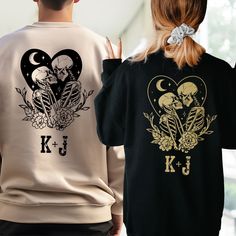 "CP20-OCC Introducing our personalized Halloween sweaters featuring intricate skeleton designs and custom embroidered couple initials. These sweaters are ideal for Halloween festivities, adding a personal touch to your spooky style. Crafted from cozy fabric and available in various sizes, they provide comfort and a snug fit for you and your partner. Elevate your Halloween fashion with these unique and eerie sweaters, ensuring you make a memorable impression at any Halloween gathering. 💙How To Order?🧡 𝟏. Choose your shirt Size, 𝟐. Choose your shirt Color, 𝟑. Select the quantity, 𝟒. Click Add To Court. For multiple items go back to the listing and repeat the steps. If you have any difficulties, send us a message or click on the \"Request A Custom Order\" button and we'll create a priva Couple Clothes, Couples Halloween Sweatshirts, Halloween Crew Neck Sweater With Skull Print, Halloween Skull Print Sweatshirt For Streetwear, Spooky Custom Print Crew Neck T-shirt, Halloween Parejas, Girlfriend Shirts, Matching Sweatshirts, Halloween Sweater