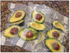 avocados are wrapped in plastic on the counter