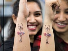 two girls with tattoos on their arms and one has a ballerina tattoo on her arm