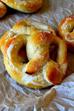 some pretzels are sitting on wax paper