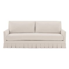 a white couch sitting on top of a wooden floor