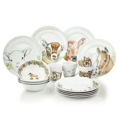 an assortment of dishes with deer designs on them