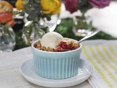 a bowl filled with oatmeal and topped with ice cream on top of a plate