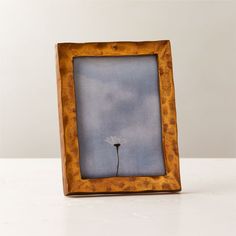 Handcrafted with a traditional sand-casting technique, metal picture frame features an organic silhouette full of raw, rough-hewn character. Adds an elegant vintage feel to the bedroom or entryway. Pair with the Abel mirror for a coordinated look. CB2 exclusive.Due to the nature of the material, brass patina will vary in color and darken over time.  -Handmade -Sand-cast aluminum frame -Sawtooth hangers for wall display -Easel back for tabletop display -Variations in texture and finish are to be Marble Picture Frame, 11x14 Picture Frame, Marble Pictures, Gold Planter, Black Picture Frame, Metal Picture Frame, Brass Picture Frames, 8x10 Picture Frames, Gold Candle Holders