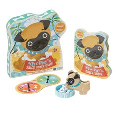 a toy pug dog and its packaging on a white background with other items in the box