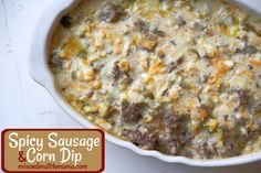 a casserole dish with sausage and corn dip