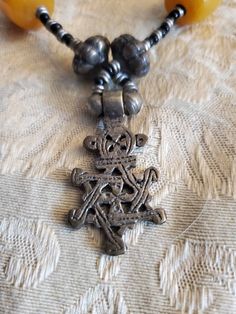 Vintage Ethiopian, Star of David, Cross 18 inch Necklace, Black , Silver Toned and Yellow Bead, Costume Jewelry, Fashion Accessory This is a nice find and very collectible. Very durable and strong. The pendant measures 1.50 inches tall and .75 inches wide. Check out our shop for monthly specials. We have a variety of items for every taste. Combine several of our items together to save on shipping. If you have any questions please do not hesitate to ask. I will ship outside of the US, just reques Star-shaped Beaded Necklace For Festival, Bohemian Star-shaped Beaded Necklaces, Festival Star-shaped Beaded Necklace, Bohemian Star-shaped Beaded Necklace, Festival Beaded Star Necklaces, Handmade Black Star Necklace, Bohemian Star Beaded Necklaces For Jewelry Making, Bohemian Black Cross Necklace, Black Bohemian Cross Necklace