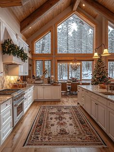 a large kitchen with white cabinets and wooden ceilinging, along with an area rug on the floor