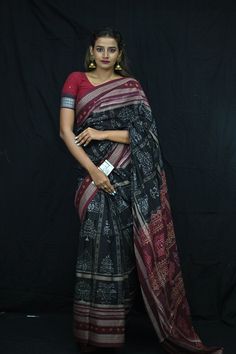 Finest pure handwoven sambalpuri ikat cotton saree with traditional motifs woven by the master weavers of Sambalpur, Odisha. It has lovely patterns and is world-famous for its gorgeous colours, texture and designs.  Specification                                                                                                                             Occasion       :- Casual Fabric               :- Sambalpuri Primary Color      :- Black Secondary Color  :-Maroon Material                :-Cotton Pattern               :- Motif Border Type   :-Ikkat Border Size       :-Medium Blouse Piece        :-Included Care               :- Dry Clean   Disclaimer : This is a genuine handwoven piece, It could expect unevenness in the selvedge and weave, and colours may fade or bleed due to the traditional Sambalpuri Saree Cotton, Black Chanderi Traditional Wear With Kalamkari Print, Black Traditional Wear With Kalamkari Print In Chanderi, Black Kalamkari Print Saree For Diwali, Black Saree With Kalamkari Print For Navratri, Black Kalamkari Saree For Navratri, Black Block Print Saree With Traditional Drape, Unstitched Black Saree With Block Print, Black Saree With Block Print And Traditional Drape