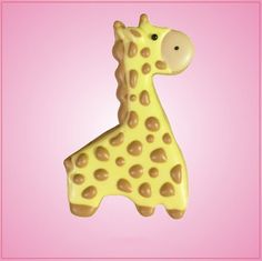 a giraffe shaped cookie on a pink background