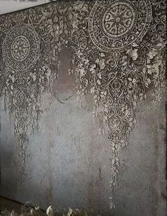 the wall is covered in an intricately designed pattern