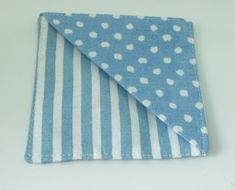 a small blue and white polka dot cloth