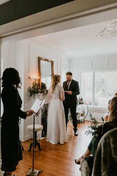 the bride and groom are getting ready to walk down the aisle at their wedding ceremony