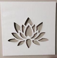 a paper cut out of a flower on a wall