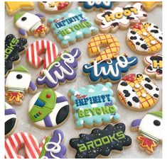 decorated cookies are displayed on a table